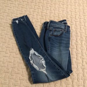 old navy blue jeans with distressing on the knees